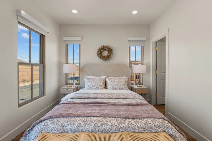 Third-floor queen bedroom with natural light at The Rad Retreat