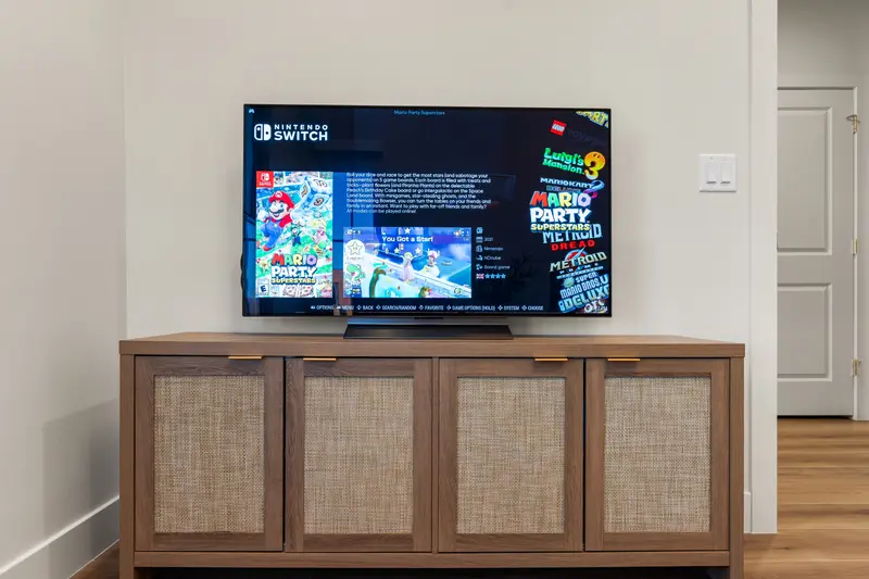 Game room TV and lounge area at The Rad Retreat