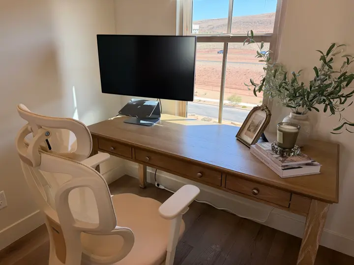 Workspace with 32" monitor and ergonomic chair at The Rad Retreat (4th floor)