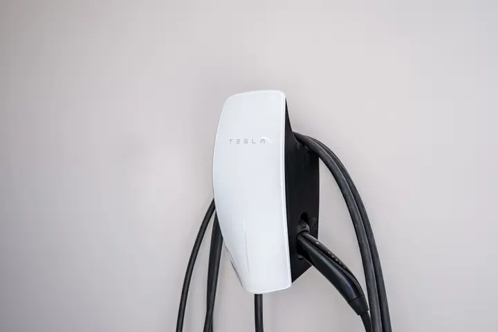 Close-up of the Tesla EV charger and charging cable